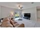 Comfortable living room with sliding glass doors leading to the backyard at 4513 Eternal Prince Dr, Sun City Center, FL 33573