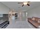 Open-concept living space with tile floors connecting kitchen and living areas at 4513 Eternal Prince Dr, Sun City Center, FL 33573