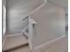 Bright staircase featuring neutral carpeted steps and white trim at 4513 Eternal Prince Dr, Sun City Center, FL 33573