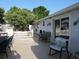 Outdoor patio area with tile flooring, dining set, and comfortable seating, perfect for entertaining at 4529 W Knox St, Tampa, FL 33614