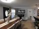 Open-concept dining room with stylish furniture and modern lighting fixtures that enhances the space at 4529 W Knox St, Tampa, FL 33614