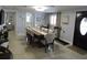 Bright dining room featuring a large dining table and access to other rooms at 4529 W Knox St, Tampa, FL 33614