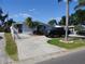 Charming single-story home with a well-maintained lawn and a long driveway leading to the house at 4529 W Knox St, Tampa, FL 33614