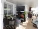 Cozy living room with tile floor, fan, TV, and large windows for natural light at 4529 W Knox St, Tampa, FL 33614