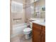 Bathroom features a bathtub, toilet, vanity and mirror, and shower curtain at 4917 Sandy Brook Crk, Wimauma, FL 33598