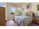 Bedroom has a comfortable bed, large windows with natural light, and stylish bedside furniture at 4917 Sandy Brook Crk, Wimauma, FL 33598