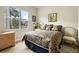 Inviting bedroom with a cozy bed, large window with natural light, and stylish decor at 4917 Sandy Brook Crk, Wimauma, FL 33598