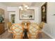 Dining room with oval table, light fixture, large mirror, and artwork at 4917 Sandy Brook Crk, Wimauma, FL 33598