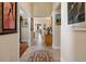 Elegant foyer featuring tile flooring, mosaic details, high ceilings, and decorative artwork at 4917 Sandy Brook Crk, Wimauma, FL 33598