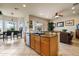 Spacious kitchen with an island, stainless steel appliances, granite countertops, and natural light at 4917 Sandy Brook Crk, Wimauma, FL 33598