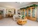 Living room with dining table, arm chair, display cabinet, and tile floor at 4917 Sandy Brook Crk, Wimauma, FL 33598