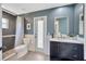 Bathroom featuring vanity, toilet, and tiled shower at 5212 Twin Creeks Dr, Valrico, FL 33596
