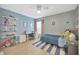 Bedroom with desk, shelving, and a bed at 5212 Twin Creeks Dr, Valrico, FL 33596