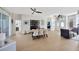 Open-concept dining area with a modern table, stylish chairs, and seamless flow at 5212 Twin Creeks Dr, Valrico, FL 33596