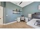 Cozy home office with shelving, a modern desk and office chair, perfect for focused work at 5212 Twin Creeks Dr, Valrico, FL 33596