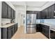 Updated kitchen with stainless steel appliances, granite countertops, and plenty of storage space at 5212 Twin Creeks Dr, Valrico, FL 33596
