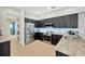 Modern kitchen featuring stainless steel appliances, granite countertops, and sleek cabinetry at 5212 Twin Creeks Dr, Valrico, FL 33596