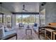 Covered lanai offers comfortable seating and views of the pool and landscaped backyard at 5212 Twin Creeks Dr, Valrico, FL 33596