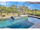 Private screened-in pool and spa offers a tranquil outdoor retreat at 5212 Twin Creeks Dr, Valrico, FL 33596