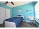Stylish bedroom with tennis racket decor, window, closet, desk and chair at 5348 Saddlebrook Way # 2, Wesley Chapel, FL 33543