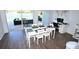Bright dining area with a large table, views of the lake, and access to the outdoor patio at 5348 Saddlebrook Way # 2, Wesley Chapel, FL 33543