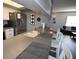 Kitchen view showcasing breakfast bar seating, stainless steel refrigerator, and sink at 5348 Saddlebrook Way # 2, Wesley Chapel, FL 33543