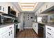 Functional kitchen with white cabinetry, stainless steel appliances, and modern fixtures at 5348 Saddlebrook Way # 2, Wesley Chapel, FL 33543