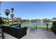 Outdoor patio with lake view and lounge seating at 5348 Saddlebrook Way # 2, Wesley Chapel, FL 33543