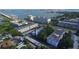 Serene aerial perspective featuring water views, tree-lined streets and building complexes at 55 Harbor View Ln # 108, Belleair Bluffs, FL 33770