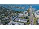 Aerial view of condominium complex with beautiful waterway and bridge at 55 Harbor View Ln # 108, Belleair Bluffs, FL 33770