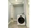 Laundry closet with a Magic Chef washer-dryer and storage at 55 Harbor View Ln # 108, Belleair Bluffs, FL 33770