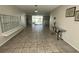 Building lobby with tile flooring, mailboxes, and glass table at 55 Harbor View Ln # 108, Belleair Bluffs, FL 33770
