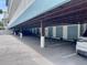 Convenient covered parking area with designated storage lockers at 55 Harbor View Ln # 108, Belleair Bluffs, FL 33770