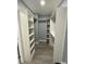 Spacious walk-in closet with custom shelving and ample storage, offering organized and convenient space at 55 Harbor View Ln # 108, Belleair Bluffs, FL 33770