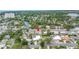 Aerial view showcasing a residential neighborhood and this property's spacious lot with mature trees and landscaping at 6630 Gulfport S Blvd, South Pasadena, FL 33707