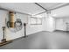 Unfinished basement area with painted walls and floor, central vac system, and compact window at 6630 Gulfport S Blvd, South Pasadena, FL 33707