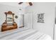 Neutral bedroom with a bed, dresser, and nautical themed poster at 6630 Gulfport S Blvd, South Pasadena, FL 33707