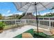 Outdoor upper deck area with seating and view of the tiki hut at 6630 Gulfport S Blvd, South Pasadena, FL 33707