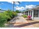 Brick-lined driveway extends along side of home to fenced parking area and exterior storage at 6630 Gulfport S Blvd, South Pasadena, FL 33707