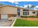 Eye-catching home entrance with distinctive architectural details and lush landscaping surrounding the property at 6630 Gulfport S Blvd, South Pasadena, FL 33707