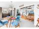 Bright open-concept space with dining area flowing into a living room and modern kitchen at 6630 Gulfport S Blvd, South Pasadena, FL 33707
