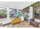 Comfortable sunroom area offering backyard views and natural light at 6630 Gulfport S Blvd, South Pasadena, FL 33707