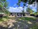 A spacious backyard featuring a well-maintained lawn and a brick patio at 6920 Bougainvilla S Ave, St Petersburg, FL 33707