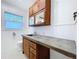 Bathroom features a vintage vanity with concrete countertop and stained glass window at 6920 Bougainvilla S Ave, St Petersburg, FL 33707