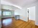 Airy living room with hardwood floors, natural light, and white walls opens to other parts of the home at 6920 Bougainvilla S Ave, St Petersburg, FL 33707