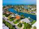 Stunning waterfront home with a pool and lush landscaping, nestled in a canal community at 781 Binnacle Point Dr, Longboat Key, FL 34228