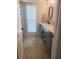 Bathroom with blue cabinets and an open shelf for towel storage at 781 Binnacle Point Dr, Longboat Key, FL 34228