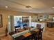 Stylish dining area open to the kitchen and patio, perfect for entertaining guests and Gathering at 781 Binnacle Point Dr, Longboat Key, FL 34228