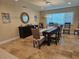 Elegant dining room with a rustic table and charming decor, bathed in natural light at 781 Binnacle Point Dr, Longboat Key, FL 34228