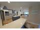 Open-concept kitchen featuring an island, modern appliances, and seamless flow to living areas at 781 Binnacle Point Dr, Longboat Key, FL 34228